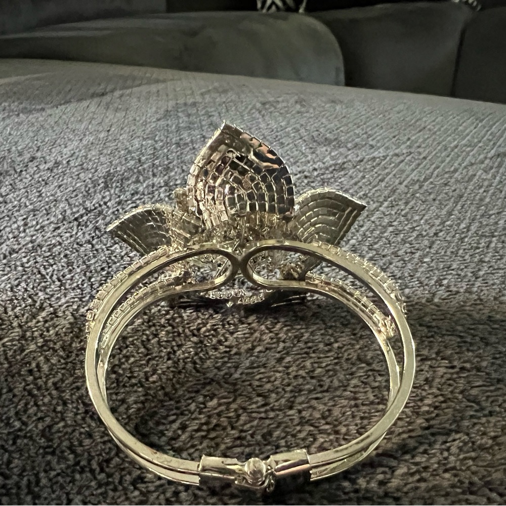 This bracelet is adorable Flower design silver overlay clasp is vey strong